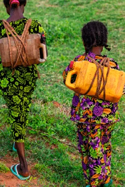 children carrying water on their backs